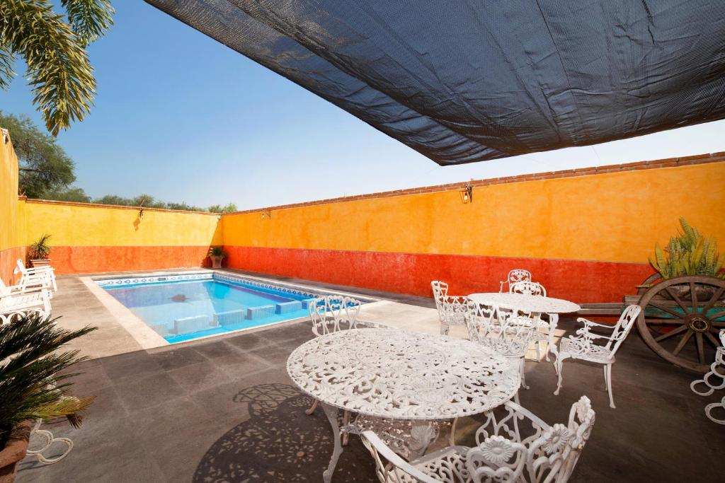 Poolside terrace with outdoor tables and seating